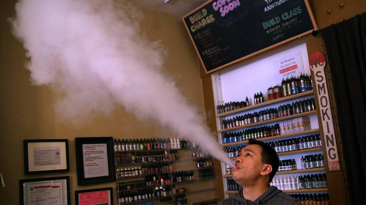 Christopher Chin blows vapor from an e-cigarette at Gone With the Smoke Vapor Lounge on May 5, 2016 in San Francisco, California.