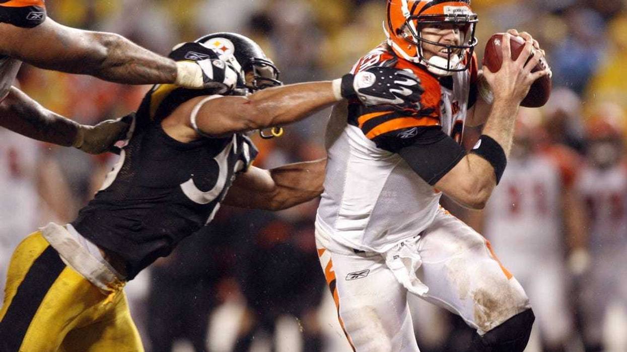 Cincinnati Bengals quarterback (9) Carson Palmer eludes Pittsburgh Steelers linebacker (53) Clark Haggans during the game at Heinz Field in Pittsburgh, PA. Pittsburgh won the game, 24-10.