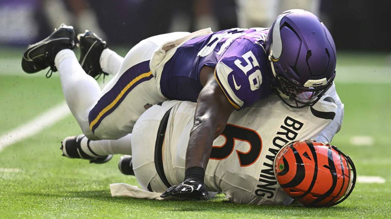 Cincinnati Bengals quarterback Jake Browning (6) feels the crush of the Vikings defense after getting sacked by linebacker Austin Keys (56) during the second half of the Vikes dominant 48-10 win at U.S. Bank Stadium.