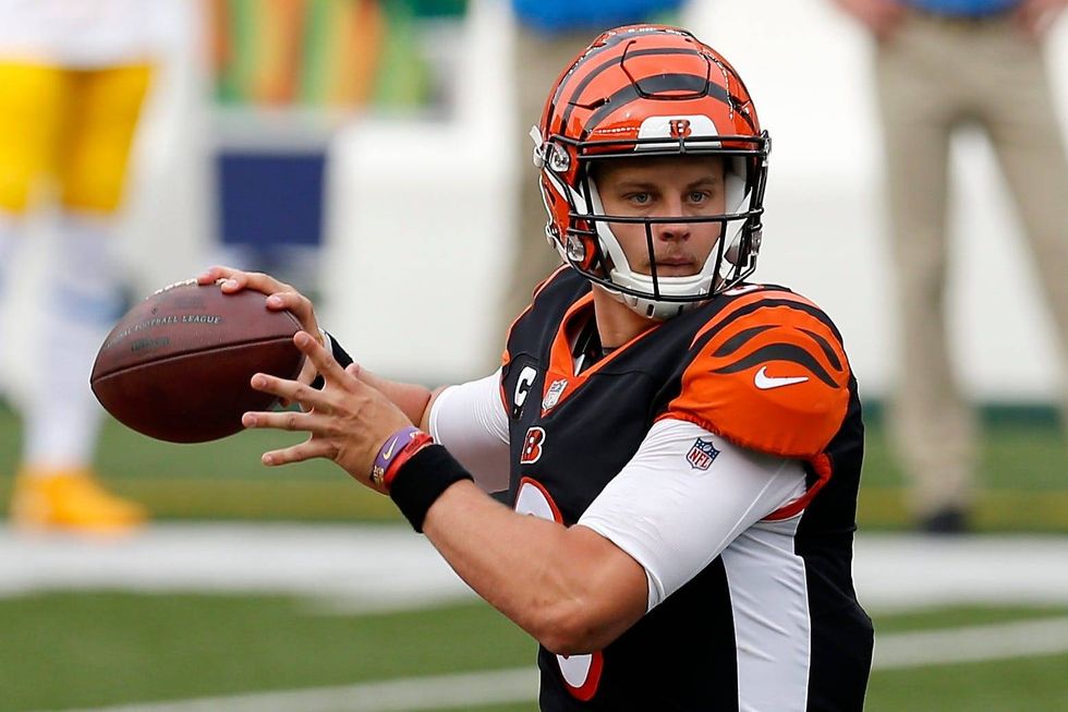 Cincinnati Bengals quarterback Joe Burrow (9) drops back to throw a pass in the first quarter of the NFL Week 1 game between the Cincinnati Bengals and the Los Angeles Chargers at Paul Brown Stadium in downtown Cincinnati on Sunday, Sept. 13, 2020.