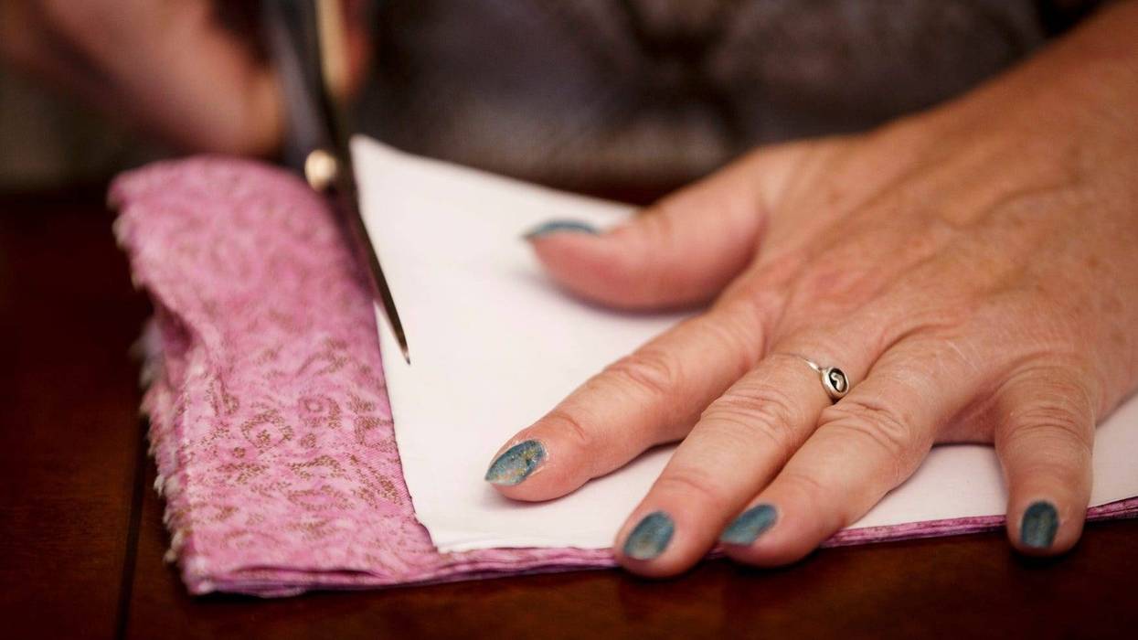 Cindy Williams of Des Moines works on making face masks at her home on Saturday, March 21, 2020, in Des Moines. \"It's sad we have to do it,\" Williams said, \"but it's a great opportunity to feel like you are doing something.\" 015 Masks 0321