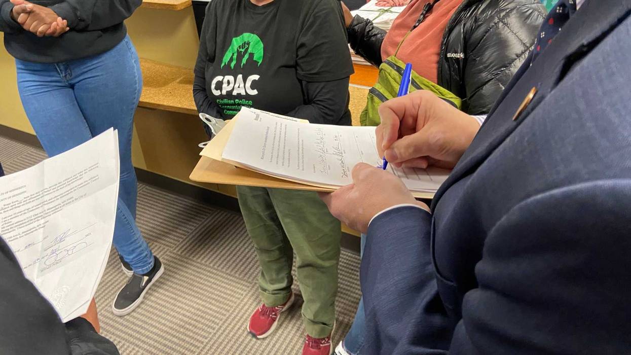 Citizens signing CPAC's petition to the city clerk.