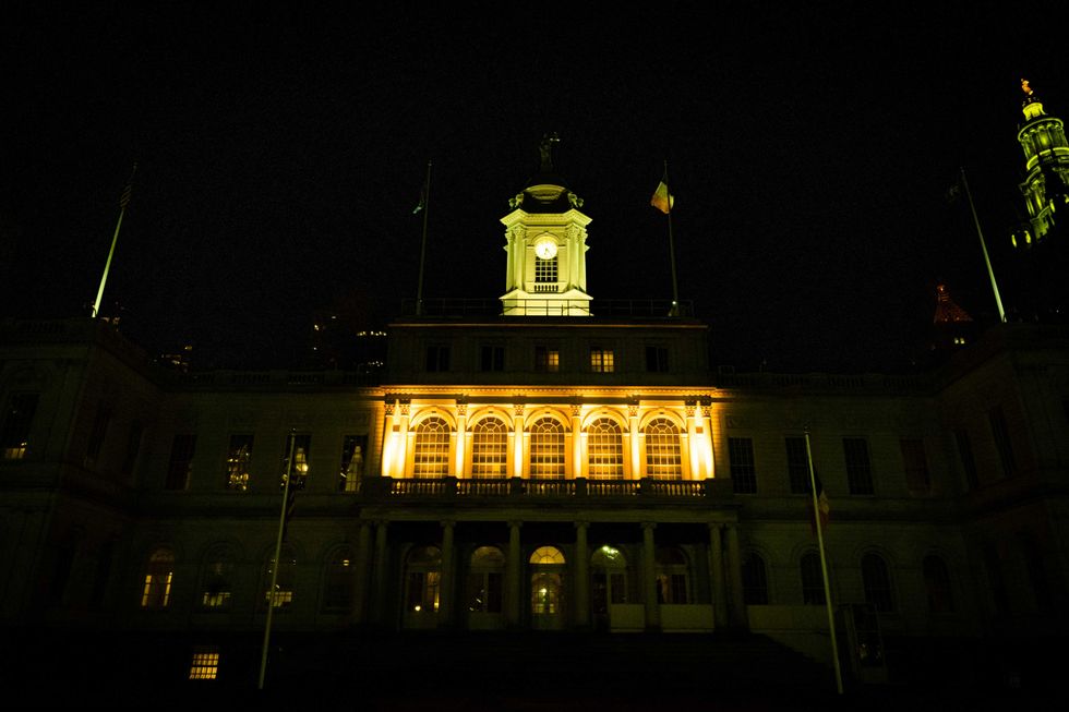 City Hall lit yellow in honor of International Holocaust Remembrance Day on January 27, 2023. The building and others will be illuminated yellow Monday night for the Oct. 7 anniversary