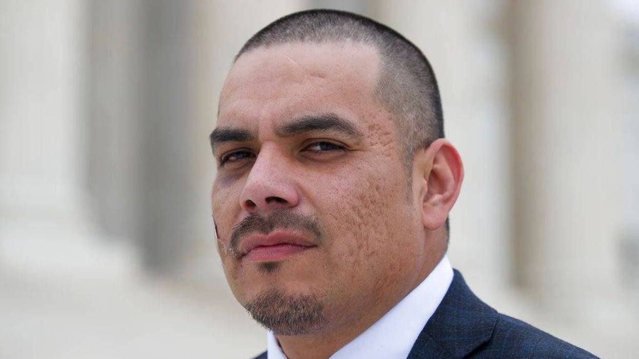 Clayvin Herrera poses for a picture on the plaza of the Supreme Court