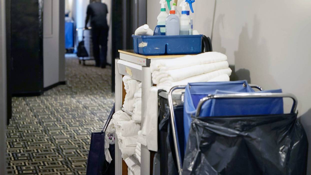 Cleaners trolley with cleaning equipments at hotel