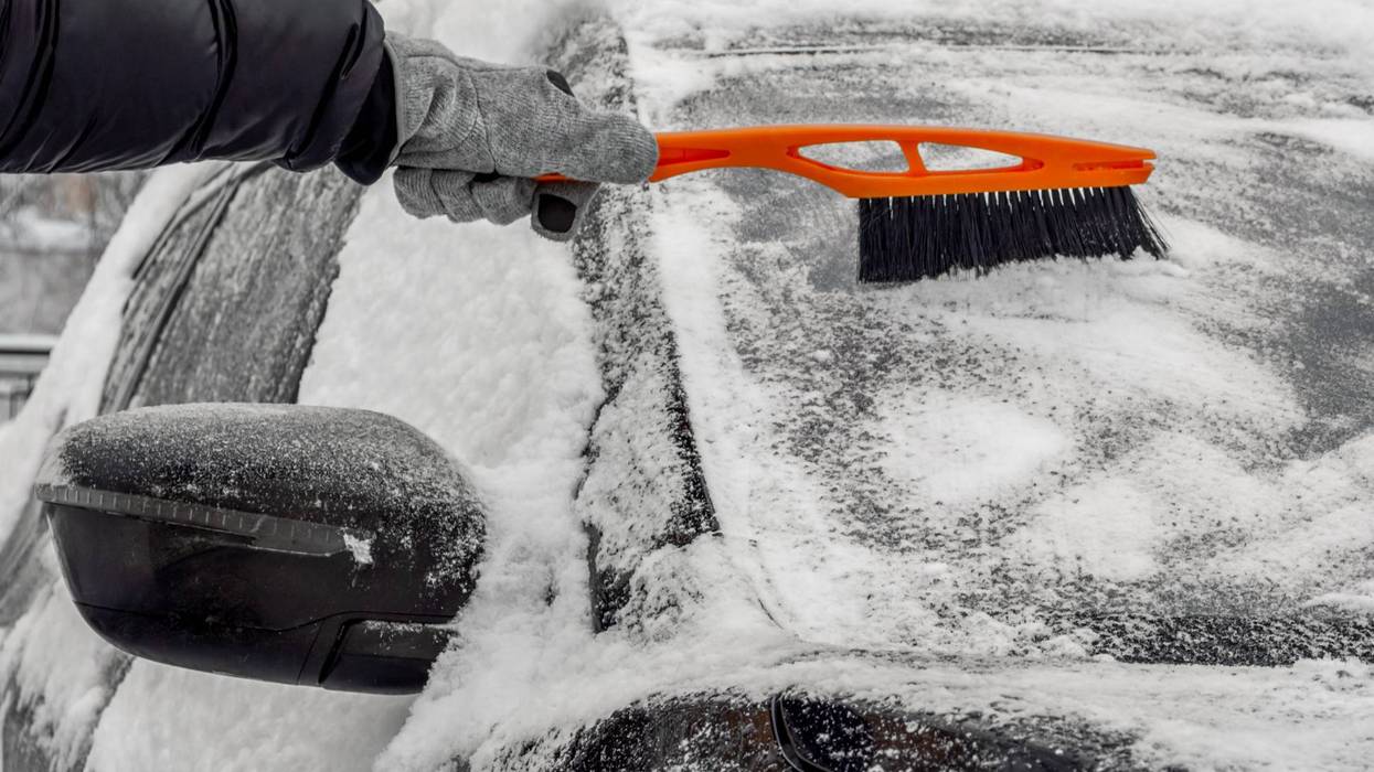 Cleaning snow off of a car