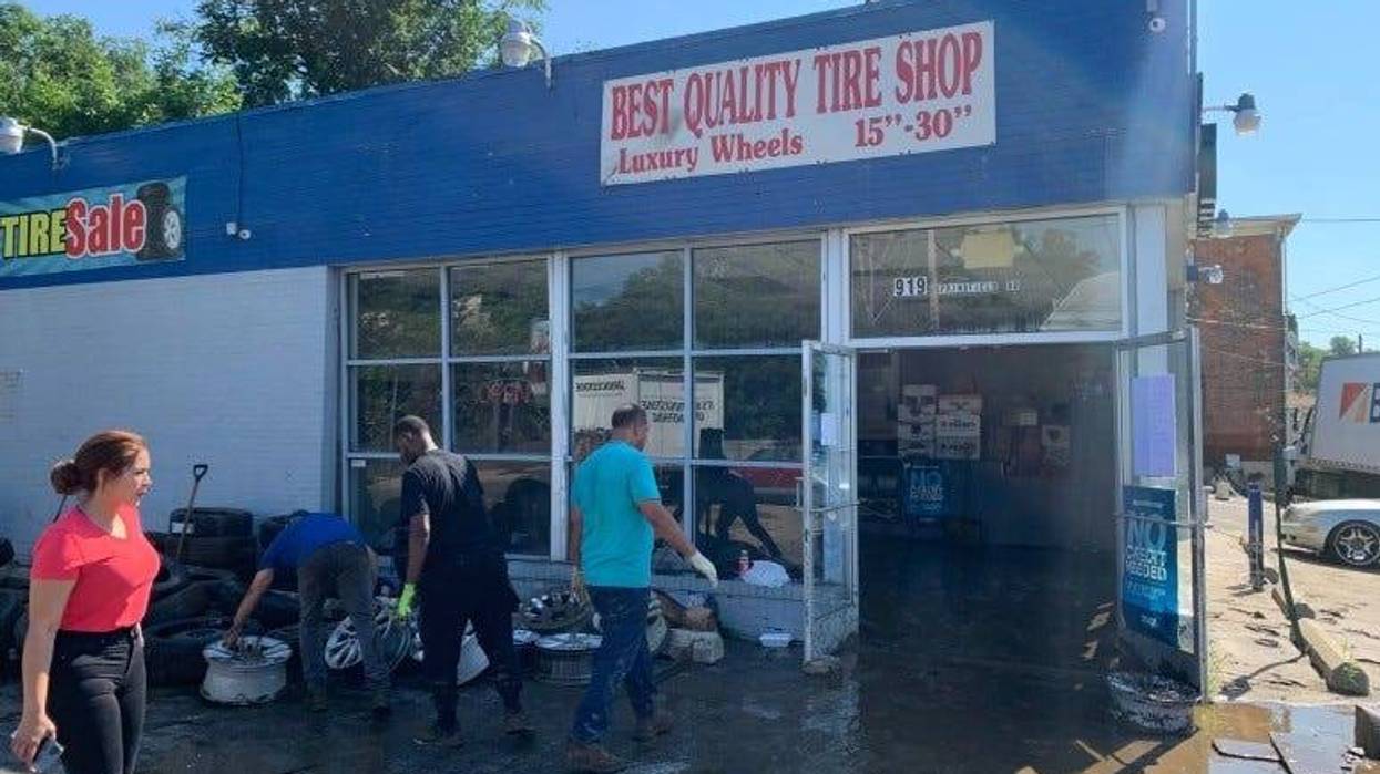 Cleaning up the aftermaths of the flood at Best Quality Tire Shop in Darby