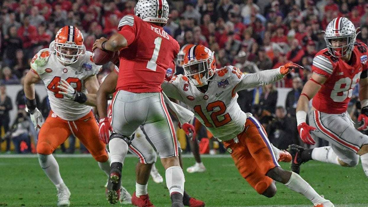 Clemson defensive back K'Von Wallace (12) sacks Ohio State quarterback Justin Fields(1) near linebacker Chad Smith (43) during the third quarter of the PlayStation Fiesta Bowl of the College Football Playoffs semi-final game, at State Farm Stadium in Glendale, Arizona Saturday, December 28, 2019. Clemson Vs Ohio State Fiesta Bowl