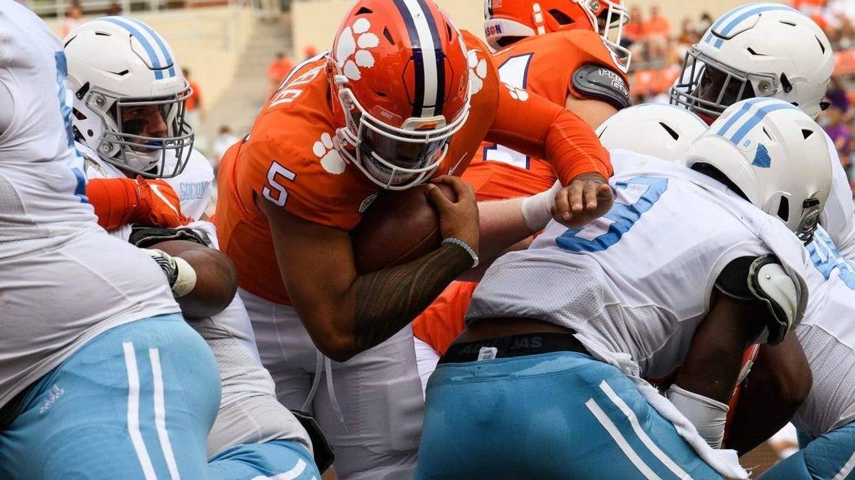 Clemson quarterback D.J. Uiagalelei (5) pushes past The Citadel defense to score a touchdown during the second quarter of their game Saturday, Sept. 19, 2020.