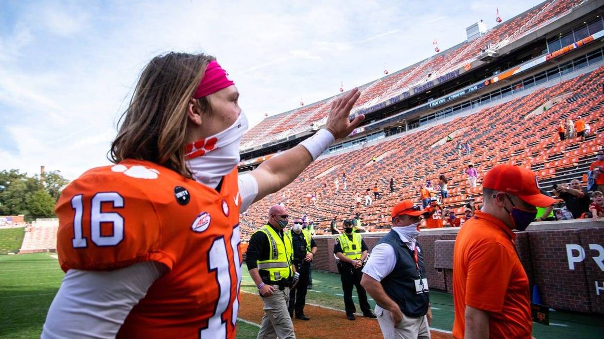 Clemson quarterback Trevor Lawrence (16) waves to fans after their game against Syracuse at Memorial Stadium.