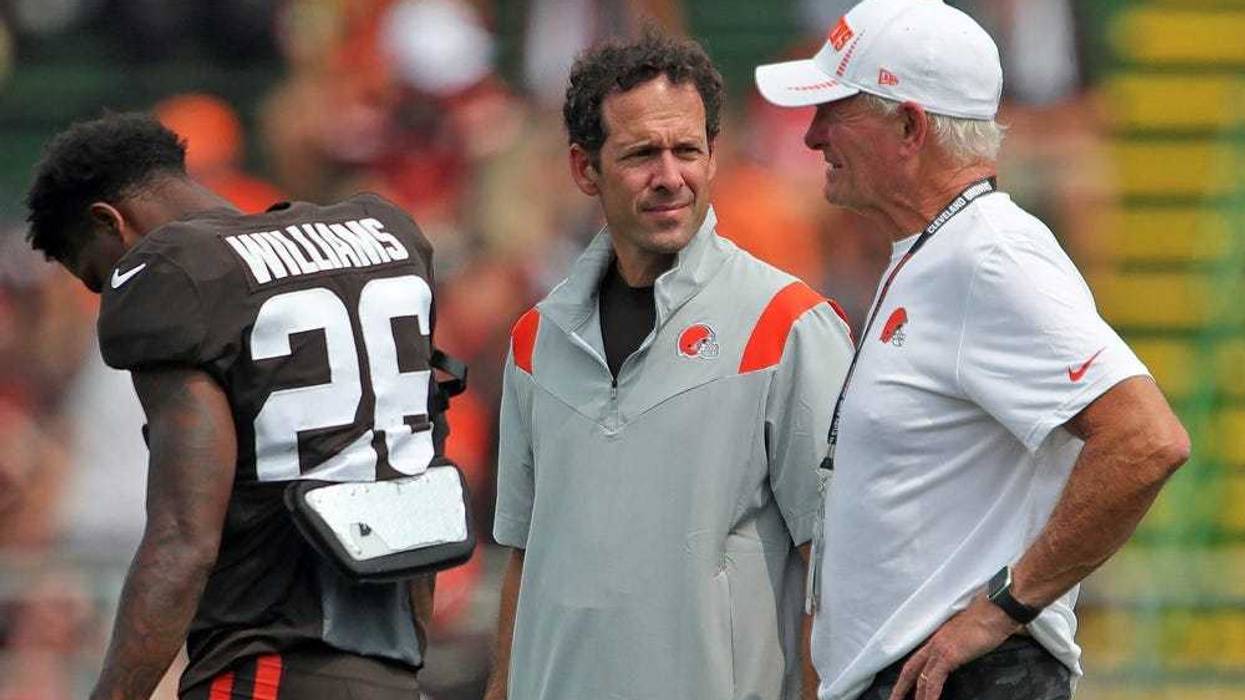 Cleveland Browns chief strategy officer Paul DePodesta, left, and owner Jimmy Haslam, right, chat on the sideline during practice, Tuesday, Aug. 10, 2021, in Berea, Ohio. Browns 18
