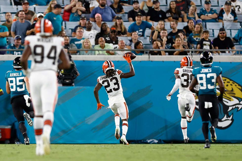 Cleveland Browns cornerback Martin Emerson Jr. (23) runs an interception back for a touchdown during the second quarter of a preseason game against the Jacksonville Jaguars at TIAA Bank Field.