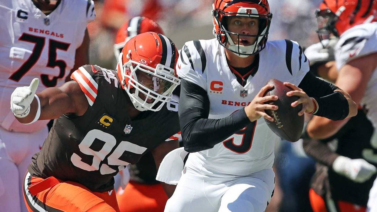 Cleveland Browns defensive end Myles Garrett (95) chases down Cincinnati Bengals quarterback Joe Burrow (9) during the first half of an NFL football game at Huntington Bank Field, Sept. 7, 2025, in Cleveland, Ohio.