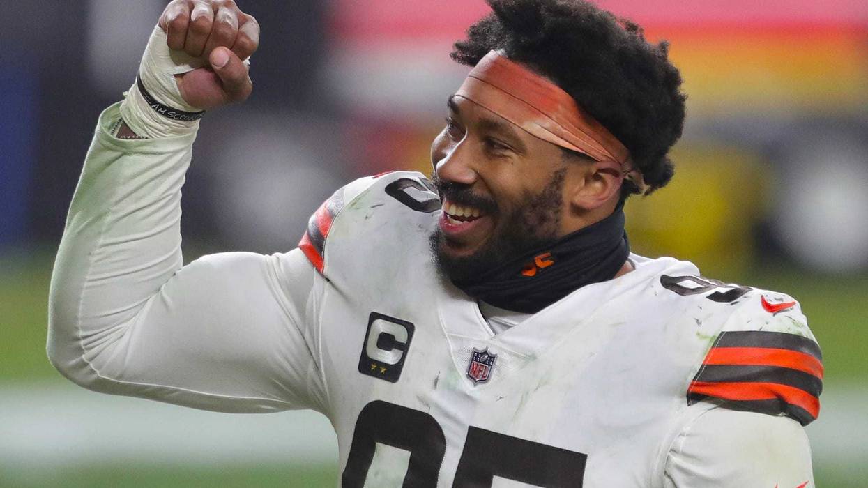 Cleveland Browns defensive end Myles Garrett (95) pumps his fist after beating the Pittsburgh Steelers in an NFL wild-card playoff football game, Sunday, Jan. 10, 2021, in Pittsburgh, Pennsylvania.