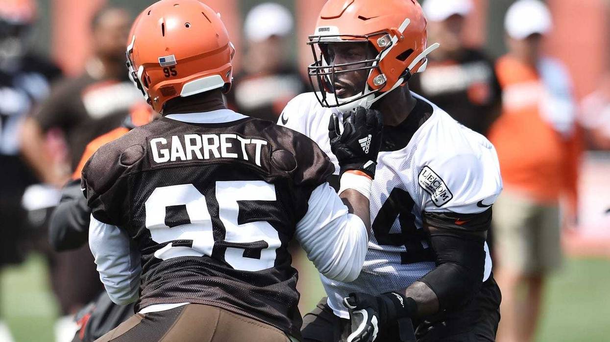 Cleveland Browns defensive end Myles Garrett (95) rushes against offensive tackle Chris Hubbard (74) during training camp at the Cleveland Browns Training Complex.