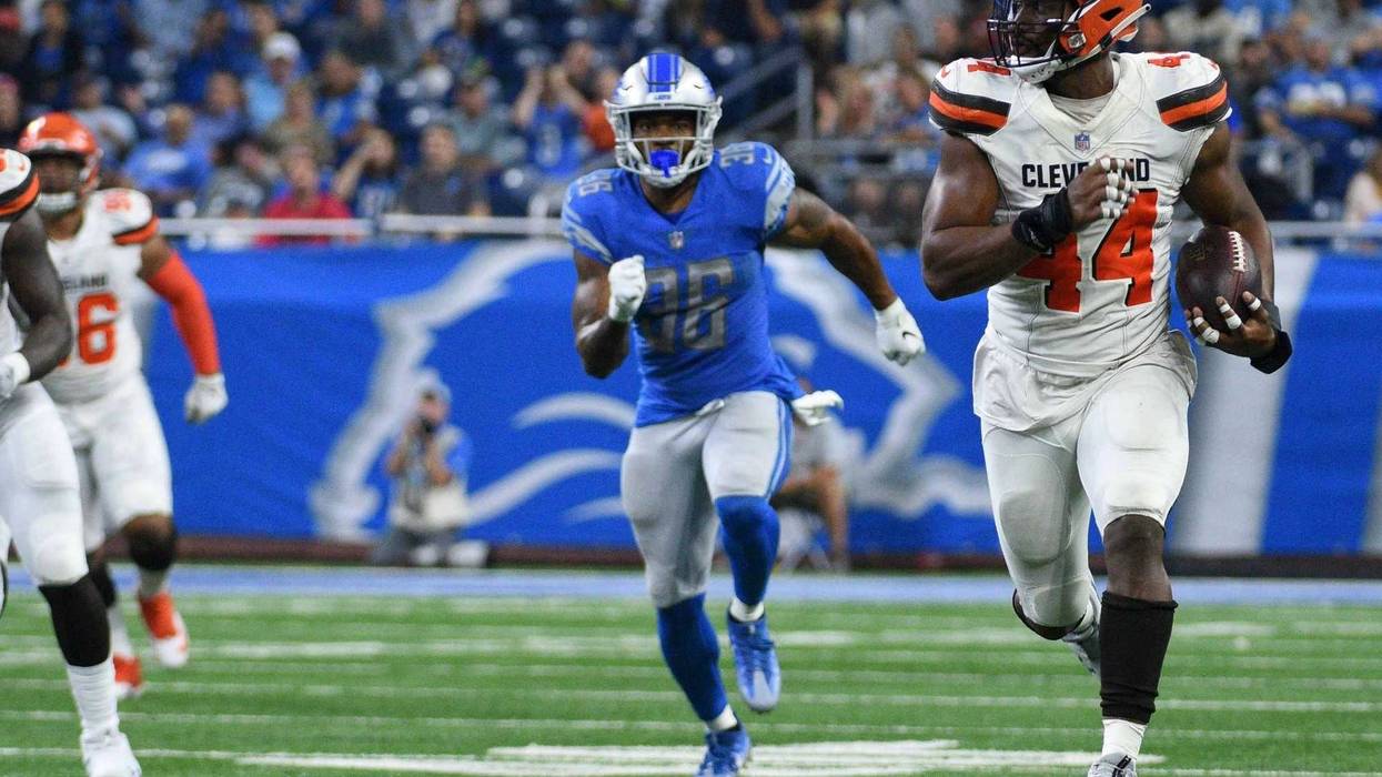 Cleveland Browns defensive end Nate Orchard (44) runs for a touchdown after making an interception during the second quarter against the Detroit Lions at Ford Field