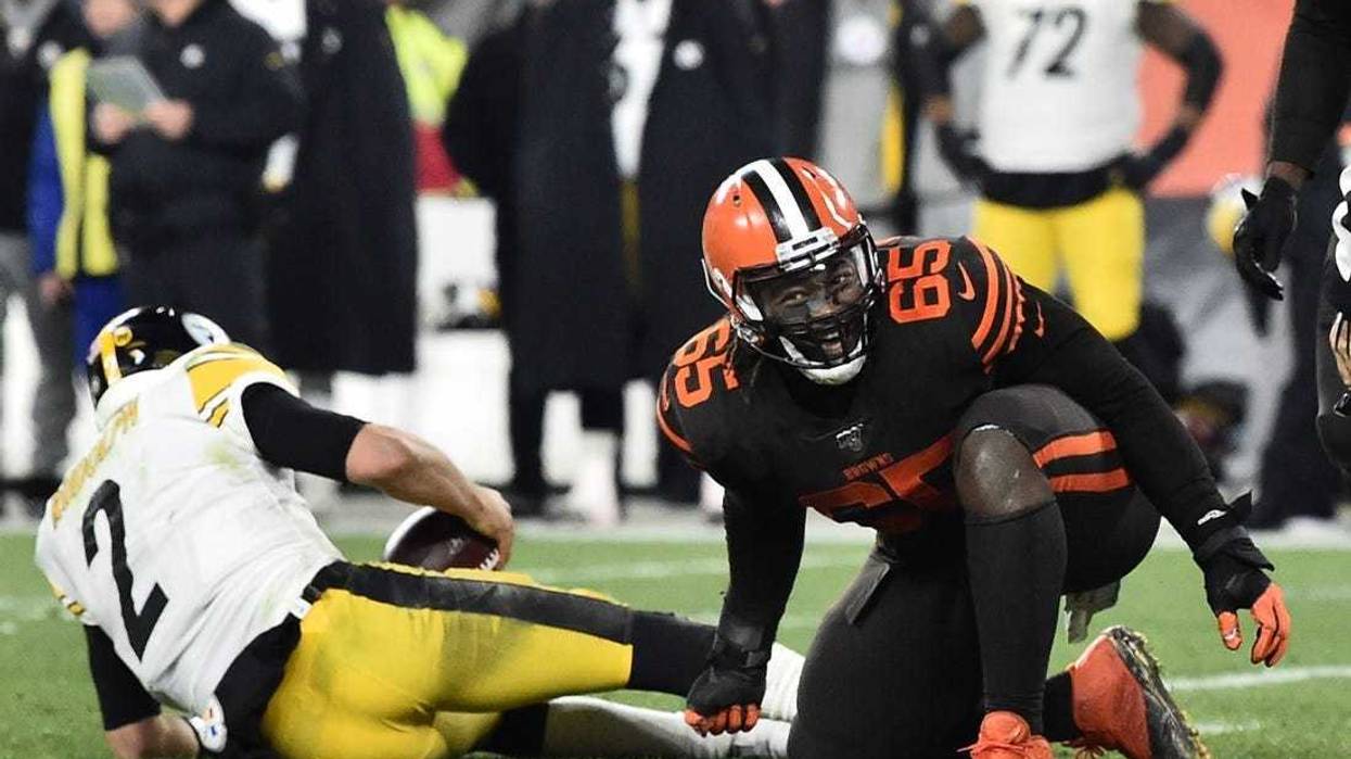 Cleveland Browns defensive tackle Larry Ogunjobi (65) celebrates after sacking Pittsburgh Steelers quarterback Mason Rudolph (2) during the second half at FirstEnergy Stadium.