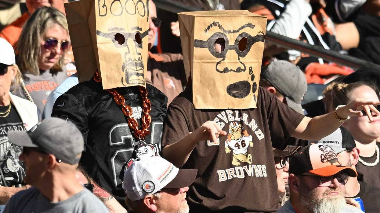 Cleveland Browns fans wear bags on their heads during the second half of the game against the Cincinnati Bengals at Huntington Bank Field.
