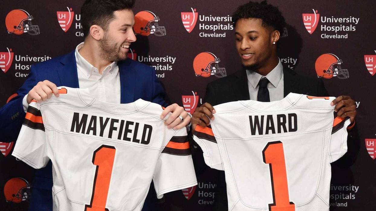 Cleveland Browns first round picks, Baker Mayfield , left, and Denzel Ward show off Browns jerseys during a press conference at the Cleveland Browns training facility.