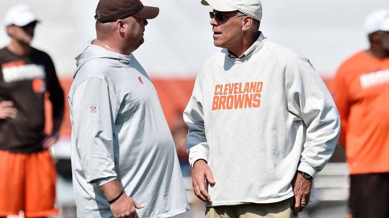 Cleveland Browns head coach Freddie Kitchens (left) talks with general manager John Dorsey during training camp at the Cleveland Browns Training Complex.