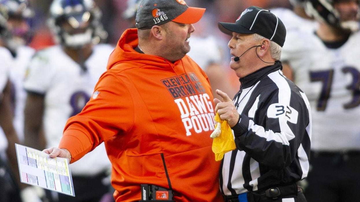 Cleveland Browns head coach Freddie Kitchens talks with head linesman Jeff Bergman (32) during the fourth quarter against the Baltimore Ravens at FirstEnergy Stadium.