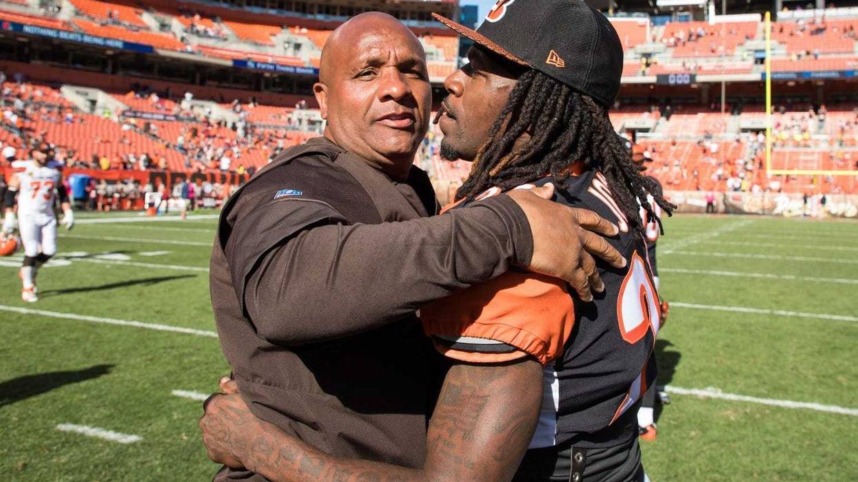 Cleveland Browns head coach Hue Jackson hugs Cincinnati Bengals cornerback Adam Jones (24) after the game at FirstEnergy Stadium.