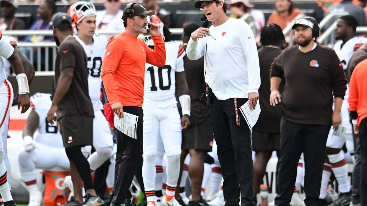 Cleveland Browns head coach Kevin Stefanski talks with offensive coordinator Ken Dorsey during the game against the Green Bay Packers at Cleveland Browns Stadium.