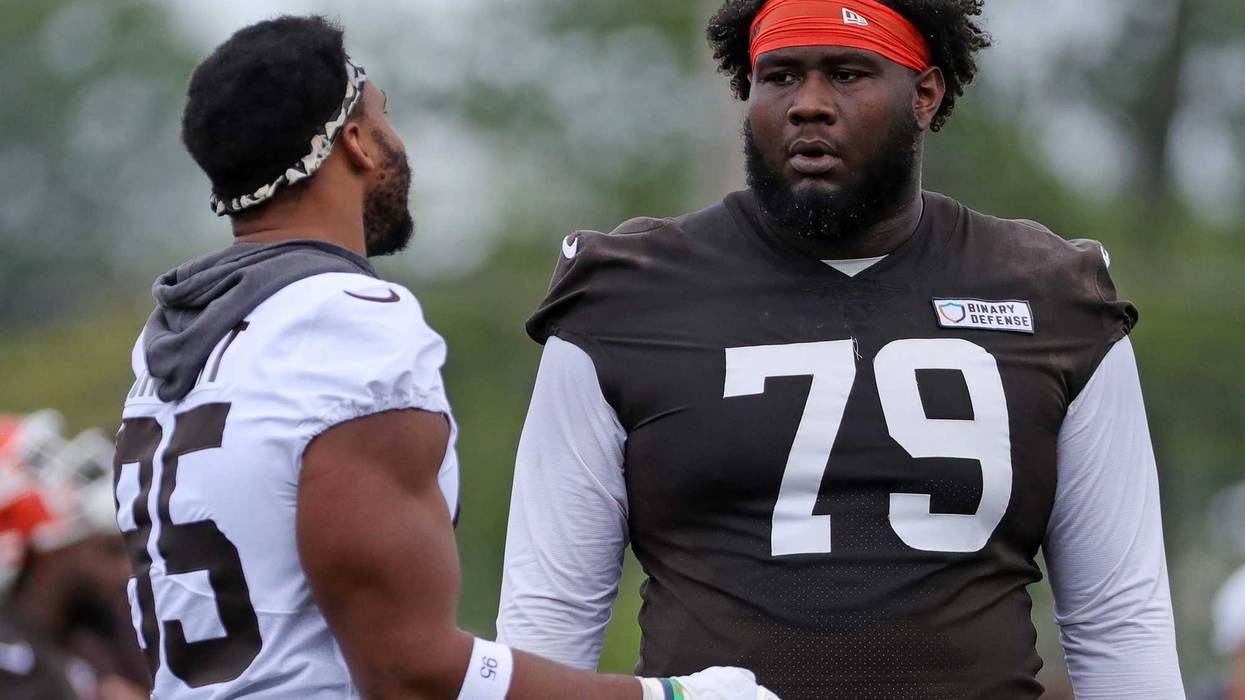 Cleveland Browns offensive tackle Dawand Jones (79) chats with defensive end Myles Garrett (95) during practice at minicamp June 10, 2025, in Berea, Ohio.