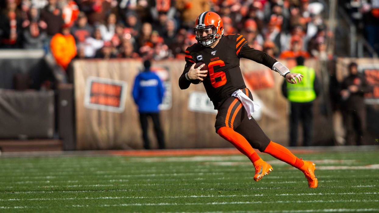 Cleveland Browns quarterback Baker Mayfield (6) carries the ball against the Cincinnati Bengals during the first quarter at FirstEnergy Stadium.