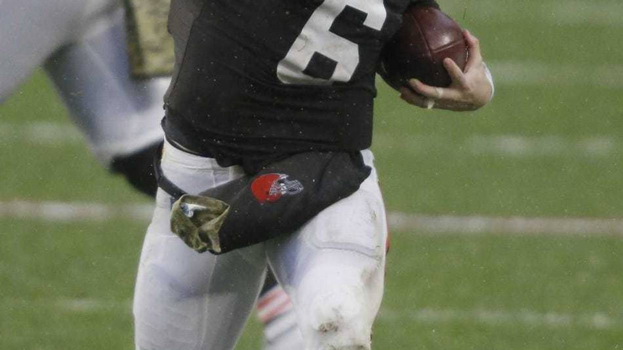 Cleveland Browns quarterback Baker Mayfield (6) motions for a first down after a run during the second half against the Philadelphia Eagles at FirstEnergy Stadium.