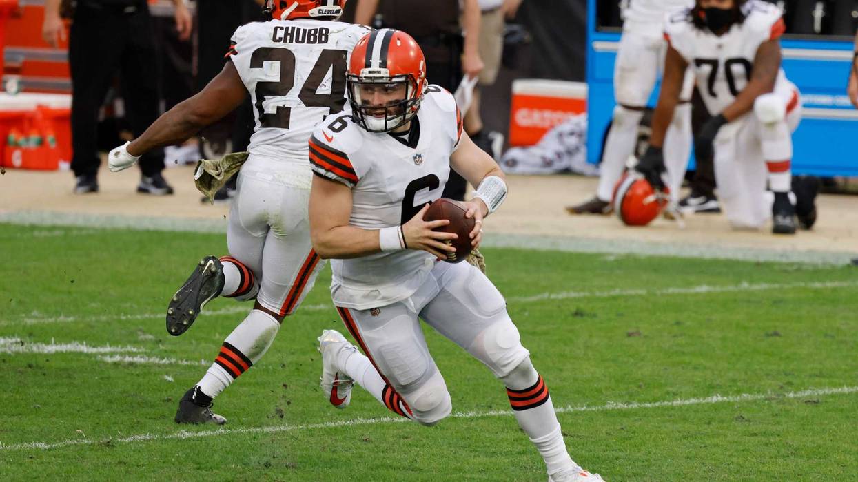 Cleveland Browns quarterback Baker Mayfield (6) rolls out as running back Nick Chubb (24) protects during the second half against the Jacksonville Jaguars at TIAA Bank Field.