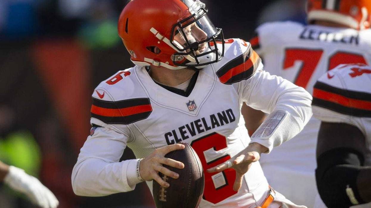 Cleveland Browns quarterback Baker Mayfield (6) throws a pass for a first down against the Carolina Panthers during the first quarter at FirstEnergy Stadium.