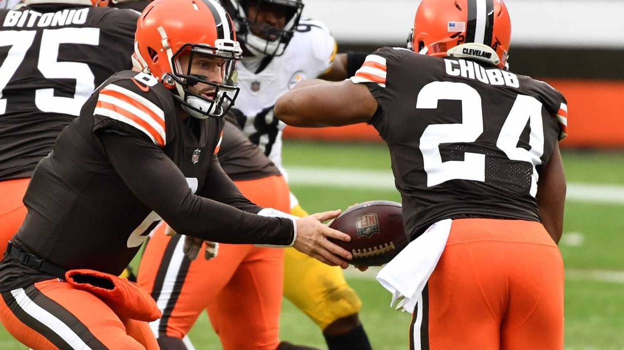 Cleveland Browns quarterback Baker Mayfield hands off to running back Nick Chubb during the first half against the Pittsburgh Steelers at FirstEnergy Stadium.