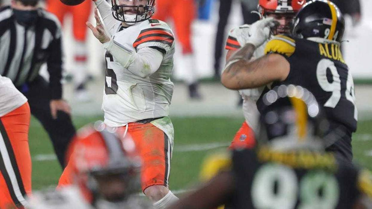 Cleveland Browns quarterback Baker Mayfield looks to make a pass during the second half of an NFL wild-card playoff football game, Sunday, Jan. 10, 2021, in Pittsburgh, Pennsylvania.