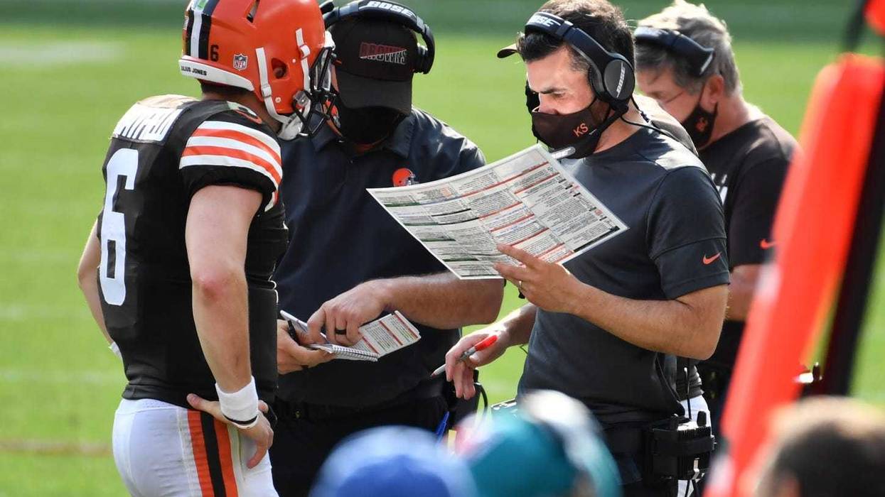 Cleveland Browns quarterback Baker Mayfield talks with head coach Kevin Stefanski
