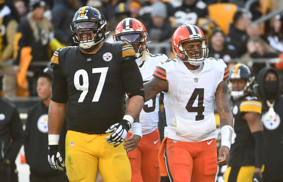 Cleveland Browns quarterback Deshaun Watson (4) and Pittsburgh Steelers defensive end Cameron Heyward (97)