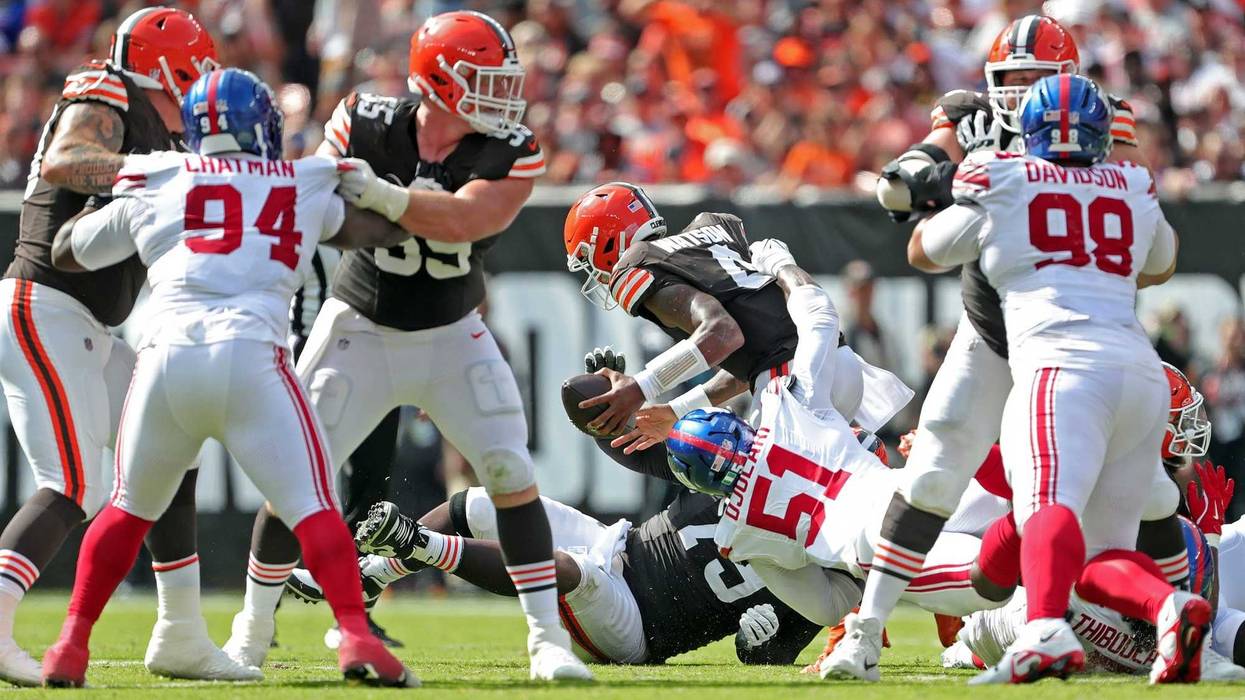 Cleveland Browns quarterback Deshaun Watson (4) is sacked by New York Giants linebacker Azeez Ojulari (51) during the second half of an NFL football game at Huntington Bank Field, Sunday, Sept. 22, 2024, in Cleveland, Ohio.