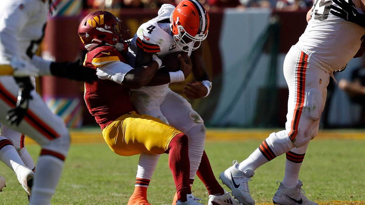 Cleveland Browns quarterback Deshaun Watson (4) is sacked by Washington Commanders linebacker Dante Fowler Jr. (6) during the third quarter at NorthWest Stadium.
