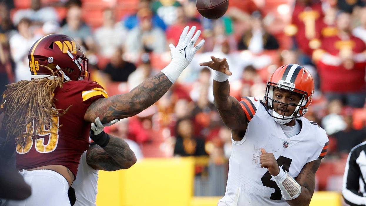 Cleveland Browns quarterback Deshaun Watson (4) passes the ball as Washington Commanders defensive end Chase Young (99) defends during the third quarter at FedExField