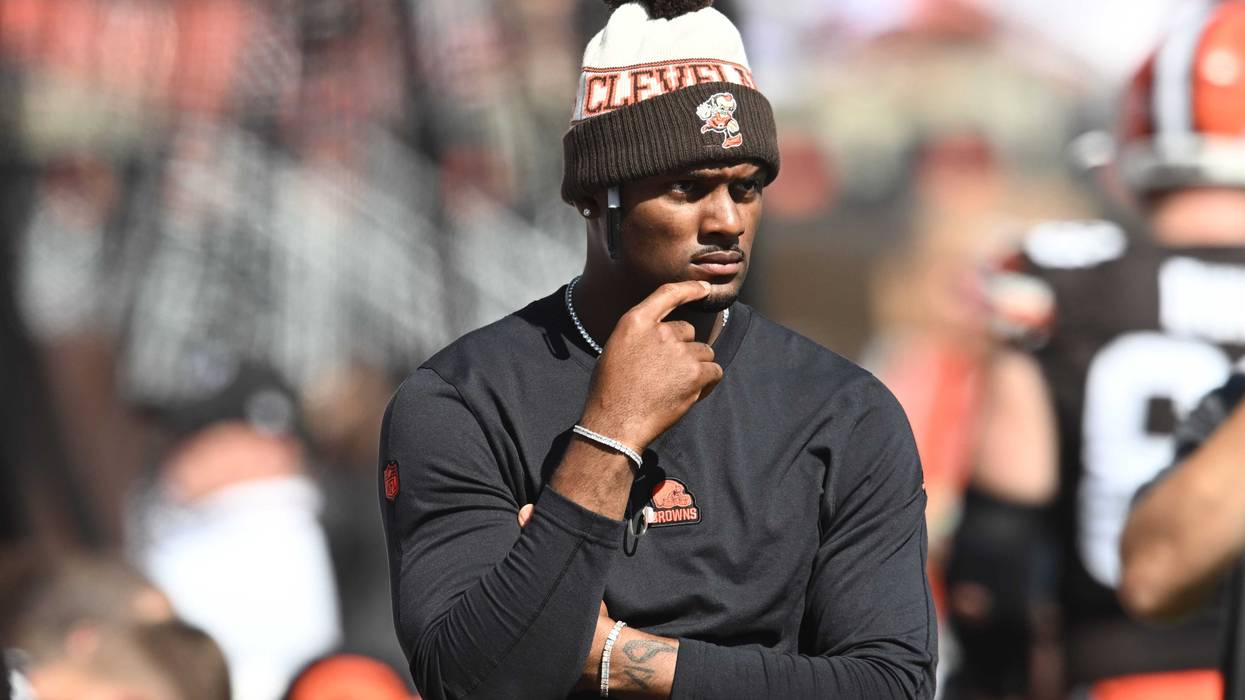 Cleveland Browns quarterback Deshaun Watson (4) watches from the sidelines during the first half against the Baltimore Ravens at Cleveland Browns Stadium.