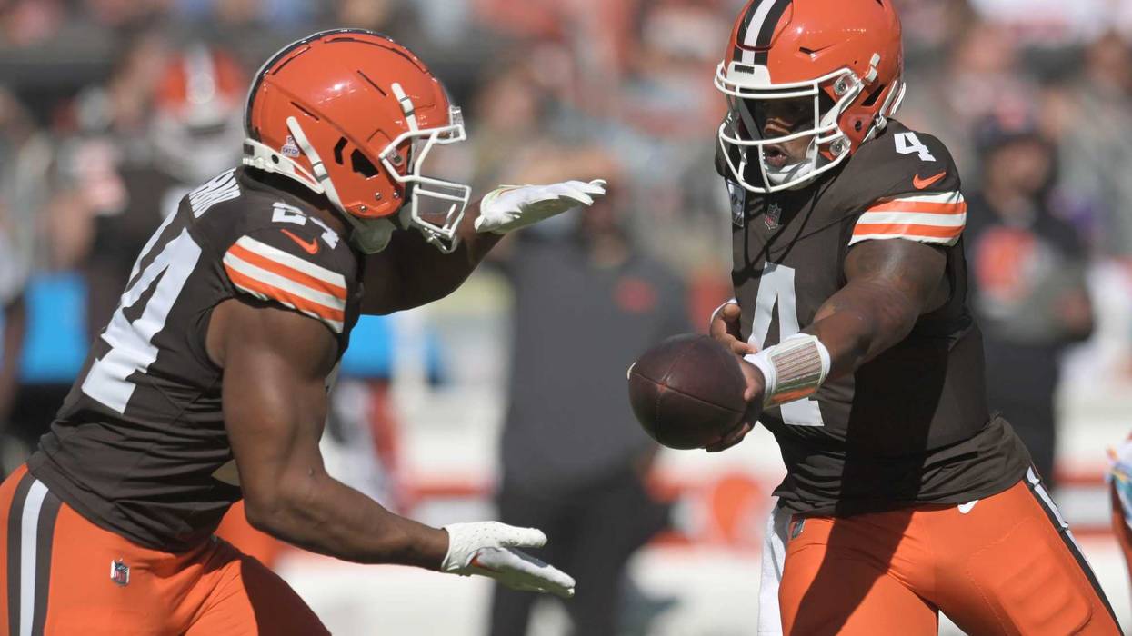 Cleveland Browns Quarterback Deshaun Watson handing off the football to Running Back Nick Chubb