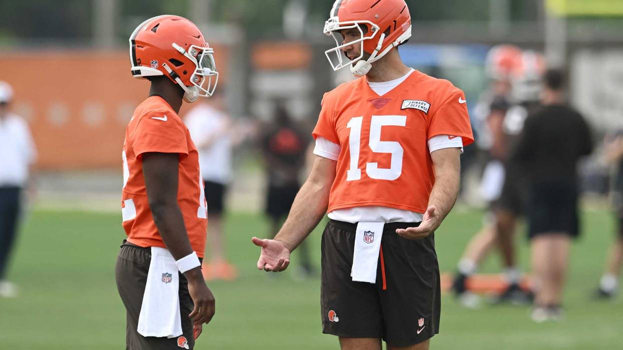 Cleveland Browns quarterback Joe Flacco (15) talks to quarterback Shedeur Sanders (12) during mini camp at CrossCountry Mortgage Campus.