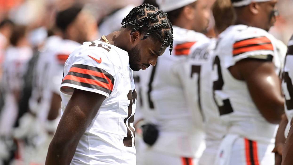 Cleveland Browns quarterback Shedeur Sanders (12) listens to the national anthem before the game between the Browns and the Los Angeles Rams at Huntington Bank Field.
