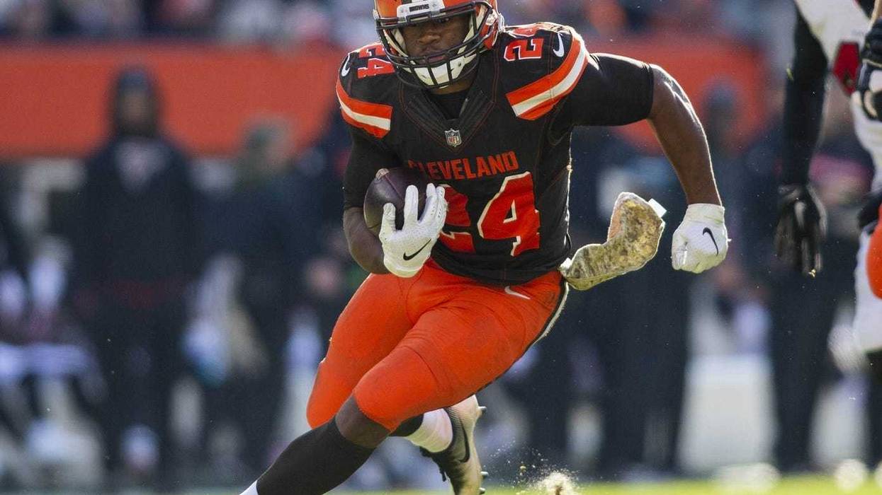 Cleveland Browns running back Nick Chubb (24) runs the ball for a first down against the Atlanta Falcons during the second quarter at FirstEnergy Stadium.