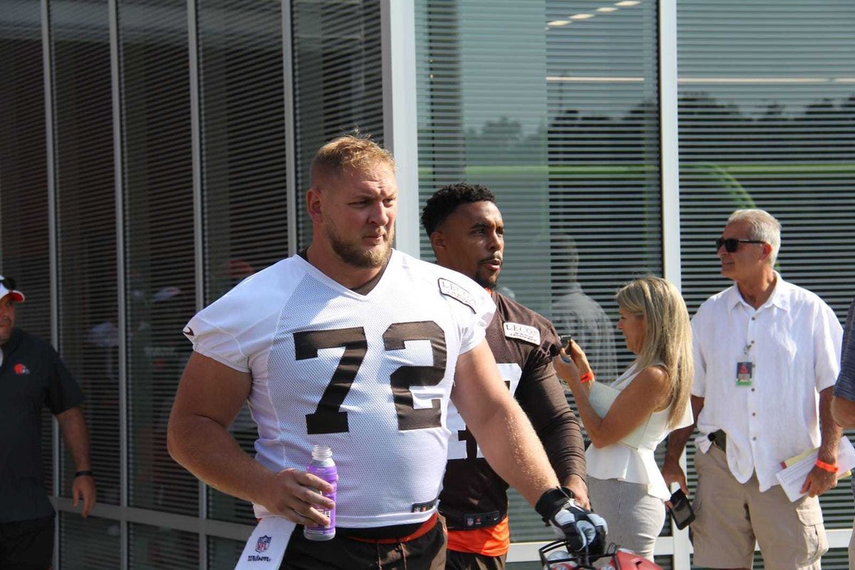 Cleveland Browns starting right guard Eric Kush enters the practice field on the first day of training camp in July
