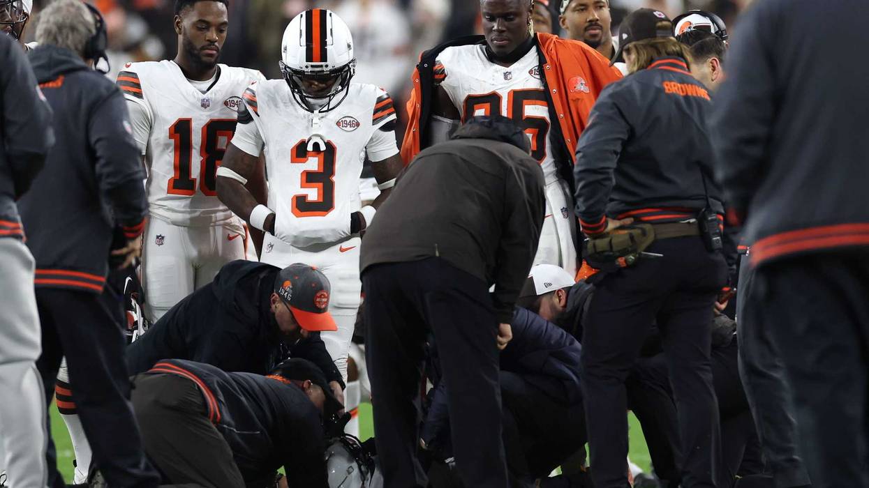 Cleveland Browns wide receiver Elijah Moore (8) is checked on by trainers during the first half against the New York Jets at Cleveland Browns Stadium.