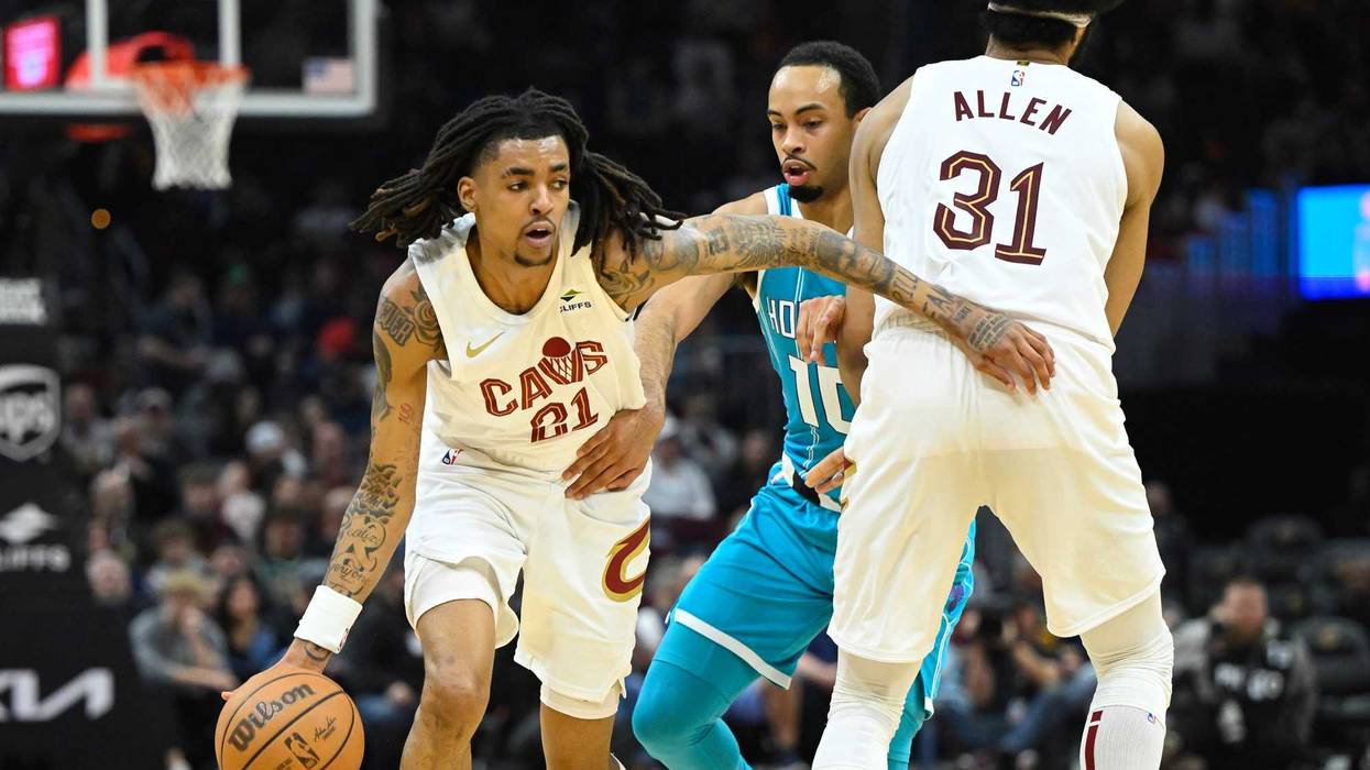 Cleveland Cavaliers forward Emoni Bates (21) dribbles around Charlotte Hornets guard Amari Bailey (10) in the second quarter at Rocket Mortgage FieldHouse.