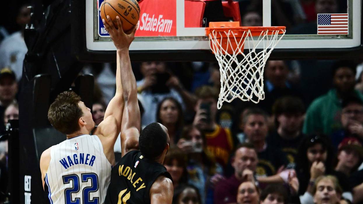 Cleveland Cavaliers forward Evan Mobley (4) blocks the shot of Orlando Magic forward Franz Wagner (22) during the fourth quarter in game five of the first round for the 2024 NBA playoffs at Rocket Mortgage FieldHouse.