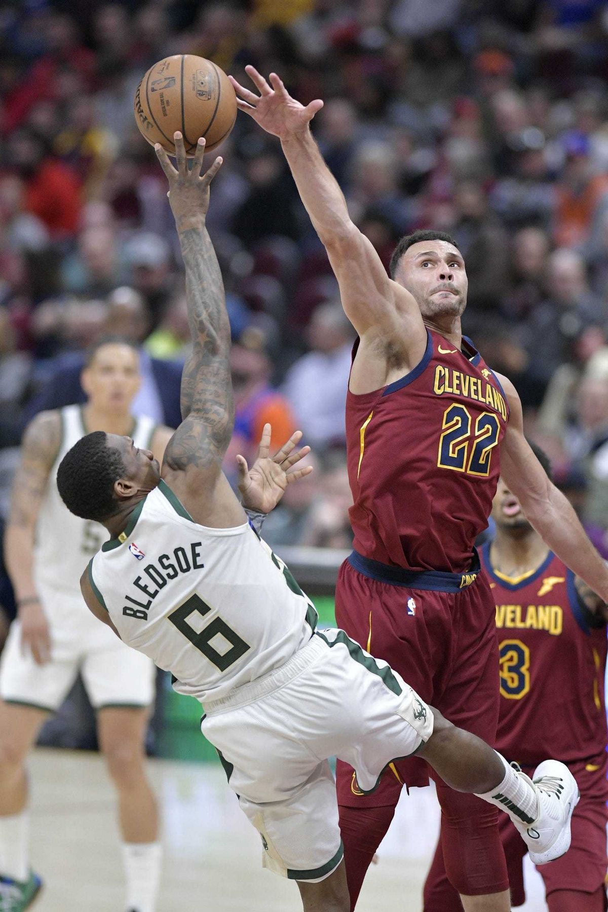 Cleveland Cavaliers forward Larry Nance Jr. (22) blocks a shot by Milwaukee Bucks guard Eric Bledsoe (6) in the third quarter at Quicken Loans Arena.