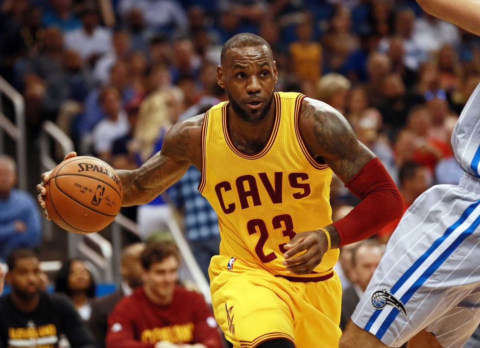 Cleveland Cavaliers forward LeBron James (23) drives to the basket against the Orlando Magic